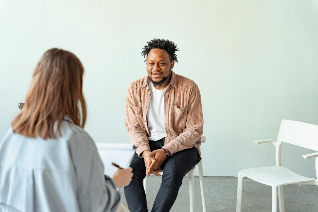 A man asking his employer how to sponsor his green card
