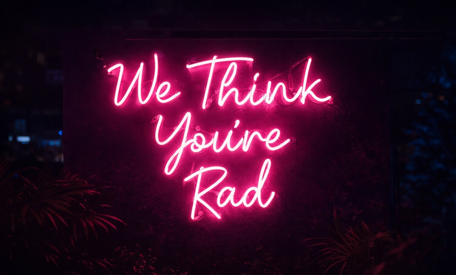 A neon sign representing employee appreciation day ideas