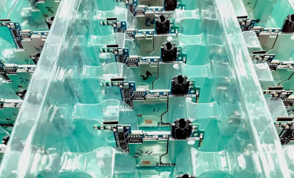A microchip assembly line representing the semiconductor manufacturing workforce