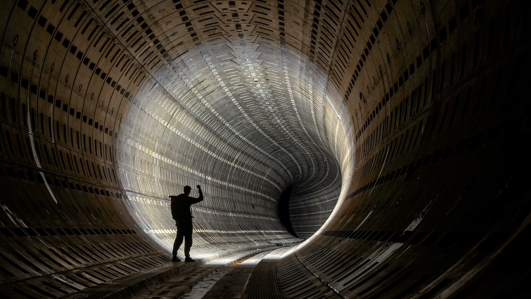 A man working in a dark tunnel representing how does overtime work in California