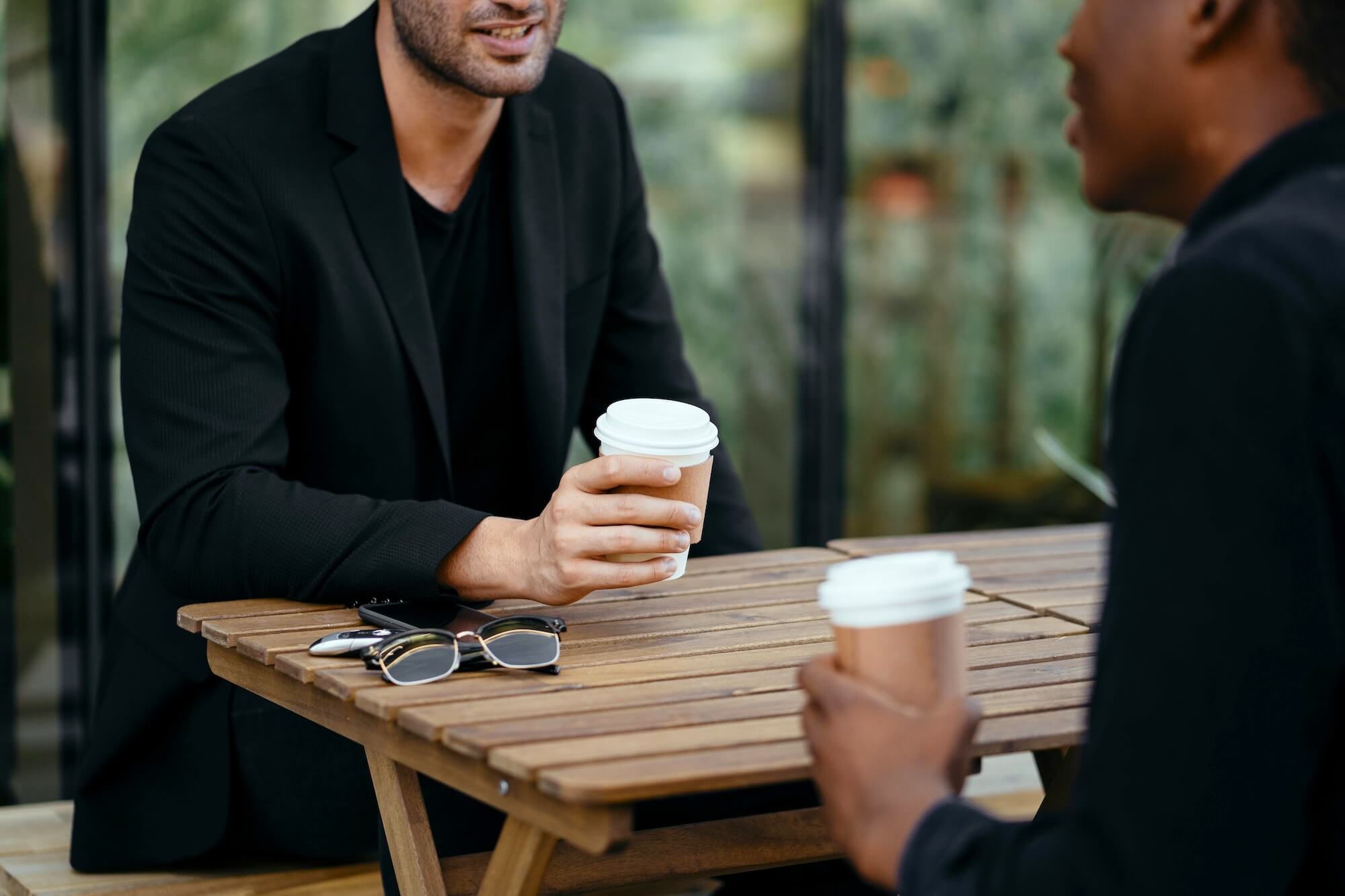 Two professionals having coffee during an informational interview